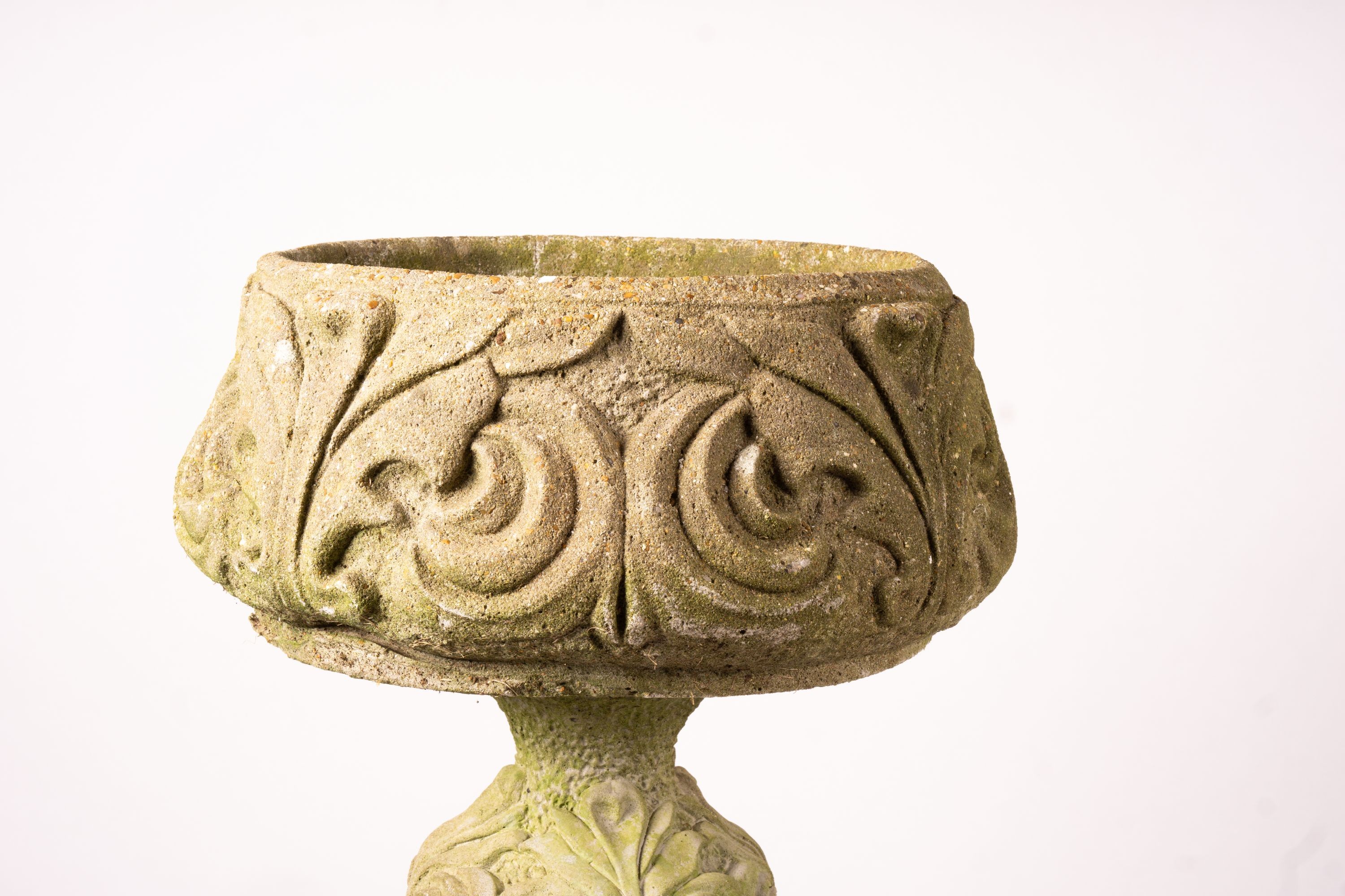 A pair of reconstituted stone circular garden planters on pedestal bases, diameter 45cm, height 110cm